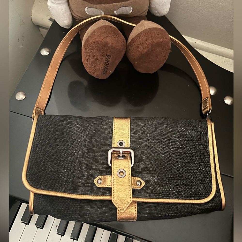 LONG CHAMP. Black and gold.